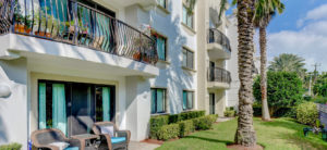 balconies and greenery, palm trees