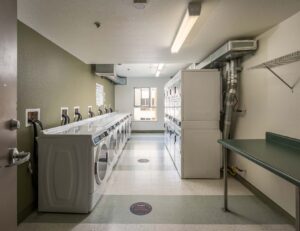 Crescent Cove laundry room, washers and dryers along both walls