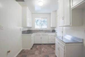 bright kitchen with white cabinetry