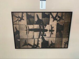 framed art collage, planes shadows on concrete