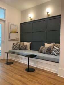 business center lounge area, built in bench with side tables, located outside of conference room