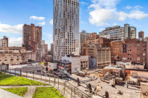 Unit Patio view of city, photo taken on a sunny day with few clouds