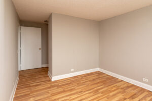 Unit Bedroom, wood floors.