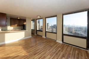 Unit Living room, Breakfast bar attached to kitchen, windows along