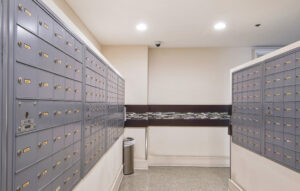 Interior mail-room, Cluster mailbox units, security cameras.