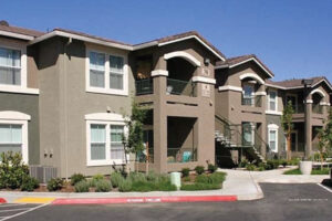 Exterior Rivers Senior residential building, 2 story walk up. photo taken on a sunny day.